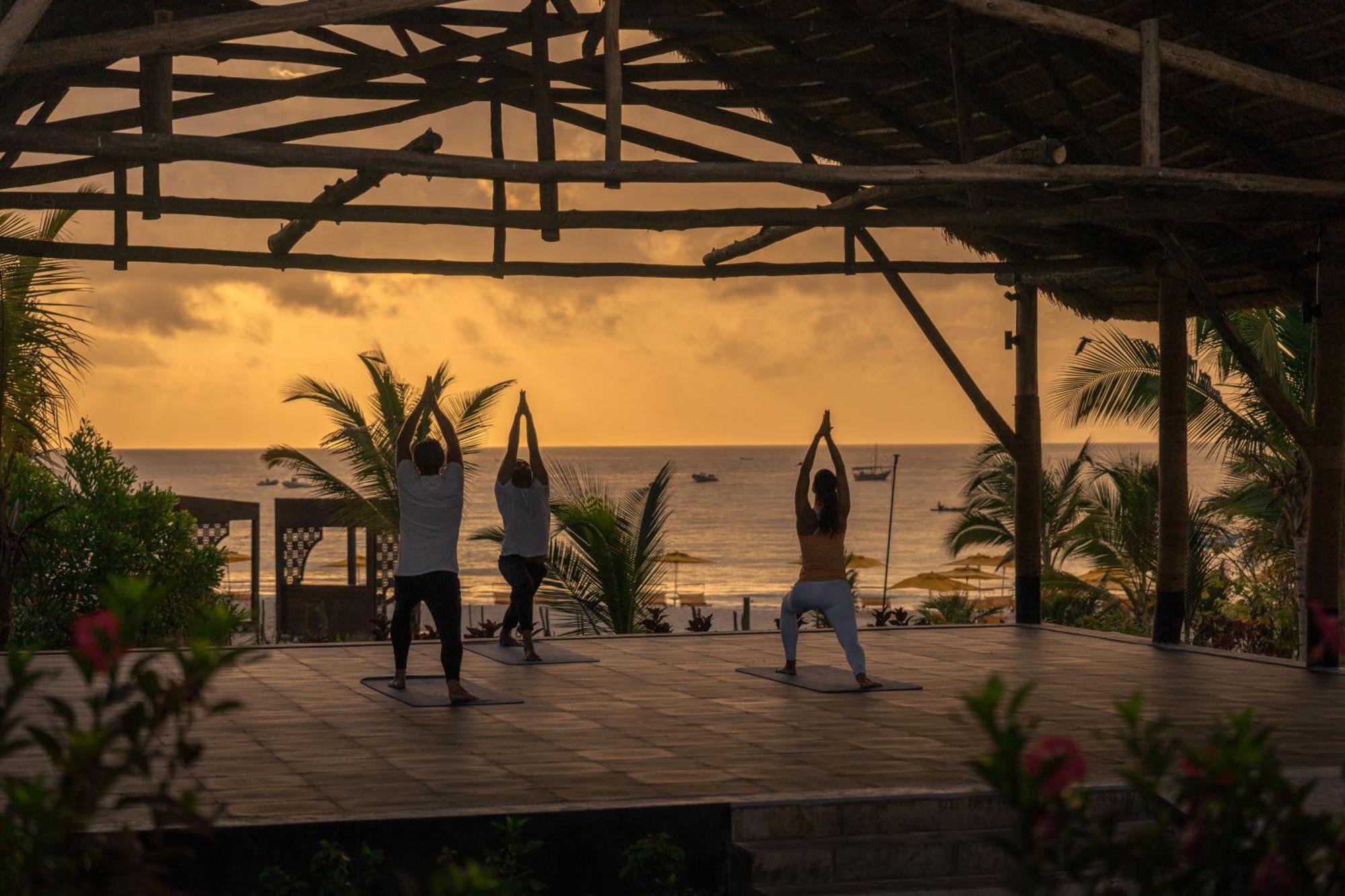 The Mora Zanzibar Hotel Matemwe  Kültér fotó Sunset yoga at the beach